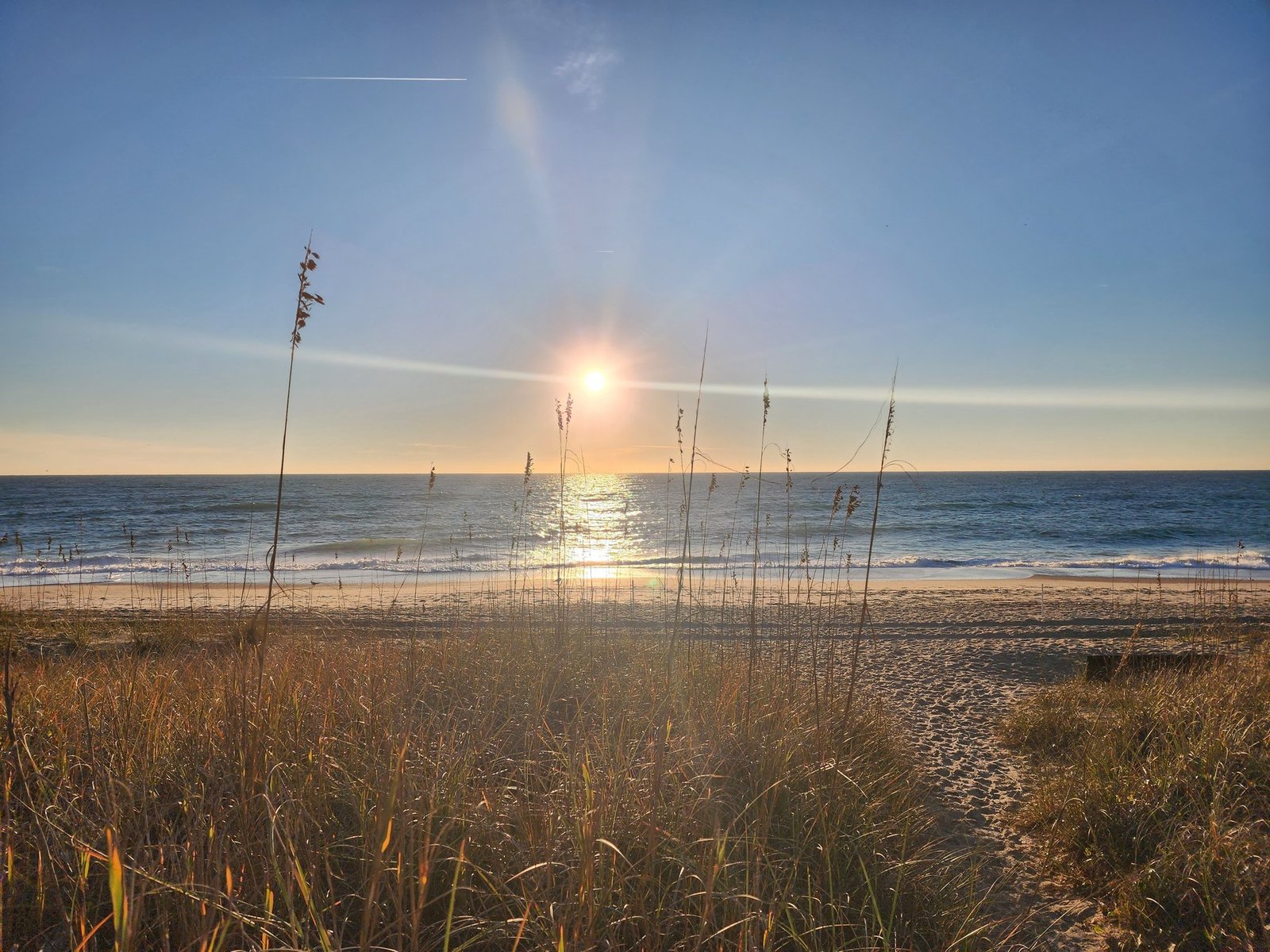 Sunrise over Wrightsville Beach, seen through the sea oats